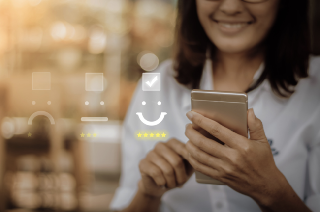 Woman giving a 5 star rating on a cell phone