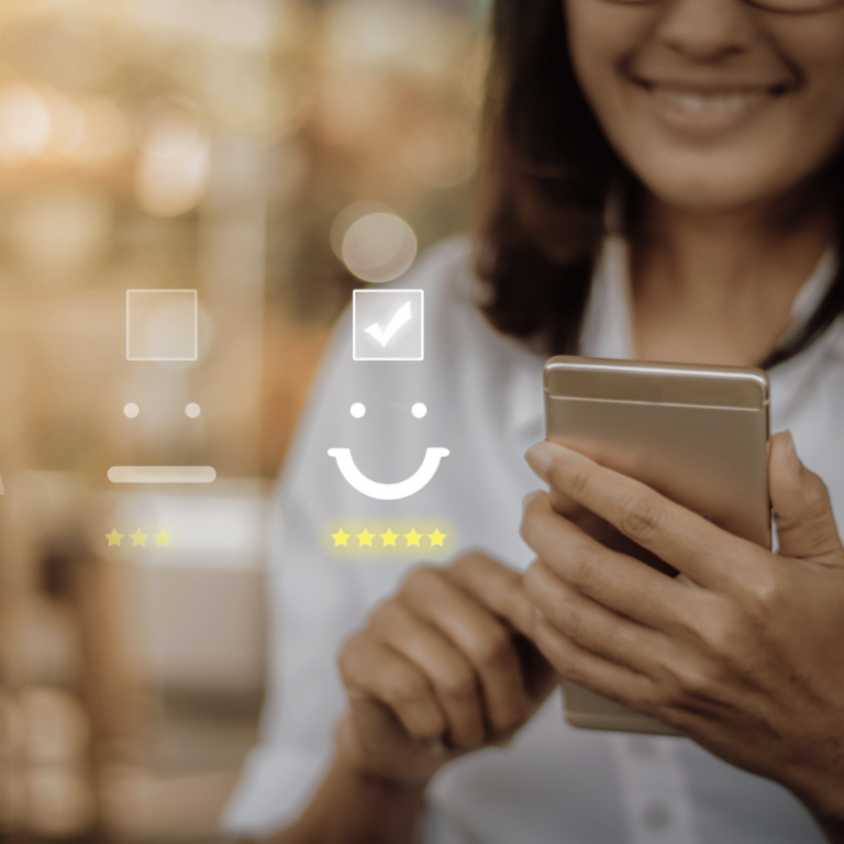 Woman giving a 5 star rating on a cell phone